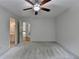 Bedroom with carpet, white walls, and open bathroom at 5245 Cottage Farm Rd, Johns Creek, GA 30022