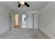 Bedroom with a ceiling fan, neutral walls, closet, and doorway to the bathroom at 5245 Cottage Farm Rd, Johns Creek, GA 30022