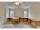 Bedroom with a large desk, carpet, ceiling fan, and natural light at 5245 Cottage Farm Rd, Johns Creek, GA 30022
