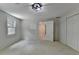 Bright bedroom with carpet floor, window, closet, and modern ceiling light fixture at 5245 Cottage Farm Rd, Johns Creek, GA 30022
