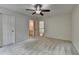 Bedroom with carpet, doors, and light-colored walls at 5245 Cottage Farm Rd, Johns Creek, GA 30022