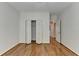 Bedroom with hardwood floors, closet, and white walls at 5245 Cottage Farm Rd, Johns Creek, GA 30022
