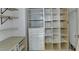 Walk in closet with built-in shelving and storage for optimal organization at 5245 Cottage Farm Rd, Johns Creek, GA 30022