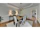 Elegant dining room with a chandelier, wood floors, and wainscoting at 5245 Cottage Farm Rd, Johns Creek, GA 30022