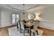 Bright dining room featuring natural light, a wood table, and hardwood floors at 5245 Cottage Farm Rd, Johns Creek, GA 30022