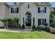 Charming front entrance features a stone path, manicured landscaping, and a welcoming doorway at 5245 Cottage Farm Rd, Johns Creek, GA 30022