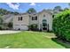 Beautiful home with a well-maintained front yard, perfect for curb appeal and outdoor enjoyment at 5245 Cottage Farm Rd, Johns Creek, GA 30022