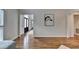 Inviting hallway with hardwood floors and white trim, leading to a bright and welcoming entryway at 5245 Cottage Farm Rd, Johns Creek, GA 30022