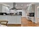 Bright kitchen features white cabinets, dark countertops, stainless appliances, and hardwood floors at 5245 Cottage Farm Rd, Johns Creek, GA 30022