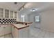 Kitchenette with a sink, bar top, tile floors, and checkered backsplash at 5245 Cottage Farm Rd, Johns Creek, GA 30022