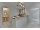 Kitchenette with a sink, bar top, tile floors, and checkered backsplash at 5245 Cottage Farm Rd, Johns Creek, GA 30022