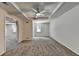 Living room with carpet, ceiling fan, natural light, and neutral walls at 5245 Cottage Farm Rd, Johns Creek, GA 30022