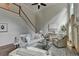 Cozy living room with a staircase, fireplace, and ample seating, perfect for Gathering gatherings and relaxation at 5245 Cottage Farm Rd, Johns Creek, GA 30022