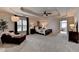 Spacious main bedroom boasts a cozy sitting area, tray ceilings and access to ensuite bathroom at 5245 Cottage Farm Rd, Johns Creek, GA 30022