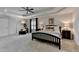 This spacious bedroom offers plush carpet, a ceiling fan, and lots of natural light at 5245 Cottage Farm Rd, Johns Creek, GA 30022