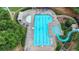 Aerial view of a large community pool featuring a slide, sun deck and ample seating at 5245 Cottage Farm Rd, Johns Creek, GA 30022
