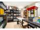 Finished basement area with shelving, storage bins, and serving area with popcorn machine at 4653 Glory Maple Trce, Powder Springs, GA 30127