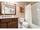 Bathroom with a vanity, mirror, toilet, and tub with shower featuring modern fixtures at 4653 Glory Maple Trce, Powder Springs, GA 30127