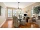 Cozy breakfast nook with hardwood floors, lots of light and decorative butterfly wall art at 4653 Glory Maple Trce, Powder Springs, GA 30127
