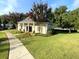 Beautiful clubhouse surrounded by green grass, mature trees, and landscaping offers relaxing community space at 4653 Glory Maple Trce, Powder Springs, GA 30127