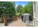 Outdoor deck with grill, perfect for entertaining and enjoying the backyard view at 4653 Glory Maple Trce, Powder Springs, GA 30127