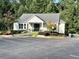 Attractive clubhouse exterior offers ample parking, tasteful landscaping, and convenient access for residents at 4653 Glory Maple Trce, Powder Springs, GA 30127