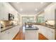 Well-lit kitchen featuring modern appliances, granite counters, white cabinetry, and an island at 4653 Glory Maple Trce, Powder Springs, GA 30127