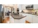 Modern kitchen featuring white cabinets, granite countertops, and stainless steel appliances with an island at 4653 Glory Maple Trce, Powder Springs, GA 30127