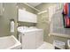 Functional laundry room with a washer, dryer, storage cabinets, and a utility sink at 4653 Glory Maple Trce, Powder Springs, GA 30127