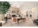 Comfortable living room with a fireplace, built-in bookshelves, neutral tones, and lots of natural light at 4653 Glory Maple Trce, Powder Springs, GA 30127