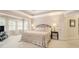 Relaxing main bedroom features trey ceilings, neutral decor, bay window and ensuite at 4653 Glory Maple Trce, Powder Springs, GA 30127