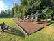 Community playground with slides, climbing structures, and benches, perfect for Gathering fun at 4653 Glory Maple Trce, Powder Springs, GA 30127