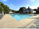 Large community pool surrounded by seating and an outdoor pavilion, creating a perfect spot for summer enjoyment at 4653 Glory Maple Trce, Powder Springs, GA 30127