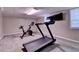Basement workout area with treadmill and stationary bike at 595 Glenforest Rd, Sandy Springs, GA 30328