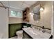 Basement bathroom featuring a marble countertop and modern decor at 595 Glenforest Rd, Sandy Springs, GA 30328