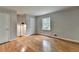 Empty bedroom with hardwood floors and a window allowing plenty of natural light at 595 Glenforest Rd, Sandy Springs, GA 30328
