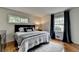 Bedroom featuring hardwood floors and large windows bringing in natural light at 595 Glenforest Rd, Sandy Springs, GA 30328