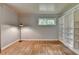 Neutral bedroom with hardwood floors, white trim and built in bookcases for ample storage and display at 595 Glenforest Rd, Sandy Springs, GA 30328