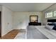 Bedroom featuring hardwood floors, a dresser, and large windows allowing natural light at 595 Glenforest Rd, Sandy Springs, GA 30328