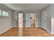 Empty bedroom with hardwood floors and access to the bathroom and other rooms at 595 Glenforest Rd, Sandy Springs, GA 30328
