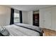Bedroom with hardwood floors, a bookshelf, and large windows allowing natural light at 595 Glenforest Rd, Sandy Springs, GA 30328