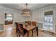 Cozy dining room with hardwood floors and a contemporary light fixture at 595 Glenforest Rd, Sandy Springs, GA 30328