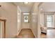Home entryway with hardwood floors, a stylish front door, and a glimpse into the inviting living space at 595 Glenforest Rd, Sandy Springs, GA 30328