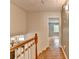 Hallway with hardwood floors and views of a living space with natural light at 595 Glenforest Rd, Sandy Springs, GA 30328