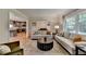 Open-concept living room showcasing hardwood floors and an easy flow to other areas of the house at 595 Glenforest Rd, Sandy Springs, GA 30328