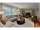 Elegant living room featuring stylish decor, hardwood floors, and large windows offering natural light at 595 Glenforest Rd, Sandy Springs, GA 30328