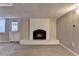 Living room with white brick fireplace, neutral paint and walkout door at 595 Glenforest Rd, Sandy Springs, GA 30328