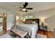 Comfortable main bedroom boasts a ceiling fan, lots of natural light, and a dresser at 595 Glenforest Rd, Sandy Springs, GA 30328