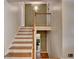 Wooden staircase with white risers leads to the upper level, showcasing the home's interior design at 595 Glenforest Rd, Sandy Springs, GA 30328