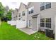 Backyard featuring a small patio, lawn, and privacy fence at 6726 Gallant Se Ct # 30, Mableton, GA 30126